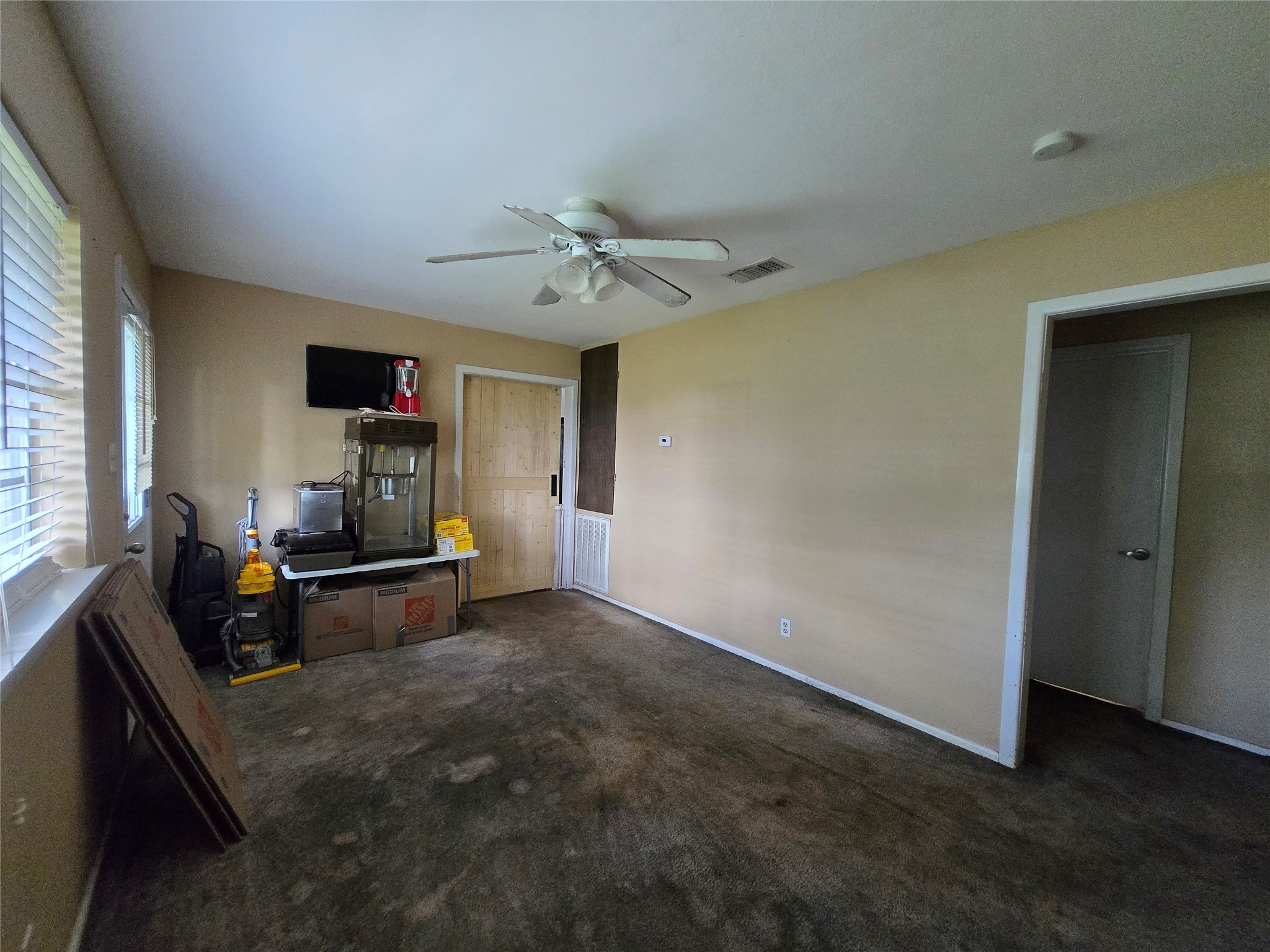 610 East Division Street Edna, TX 77957 - Photo 25 of 38 a living room with furniture and a flat screen tv