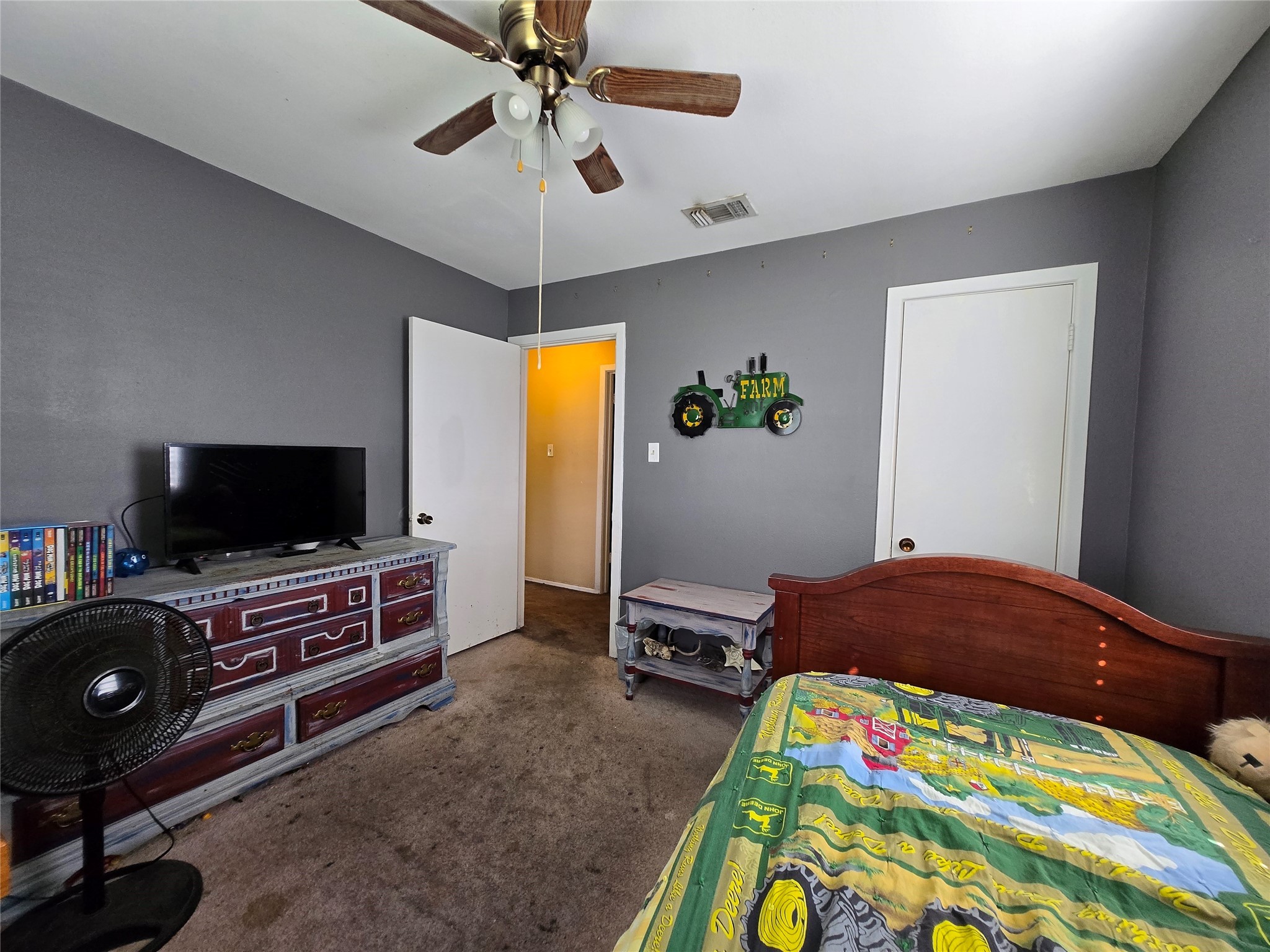 610 East Division Street Edna, TX 77957 - Photo 30 of 38 a bedroom with a bed and flat screen tv