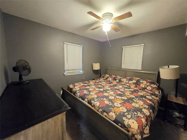 a bedroom with bed and window