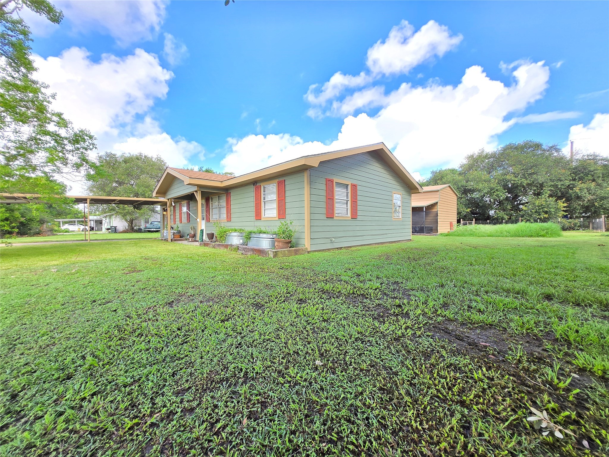 610 East Division Street Edna, TX 77957 - Photo 5 of 38 a view of a house with a yard