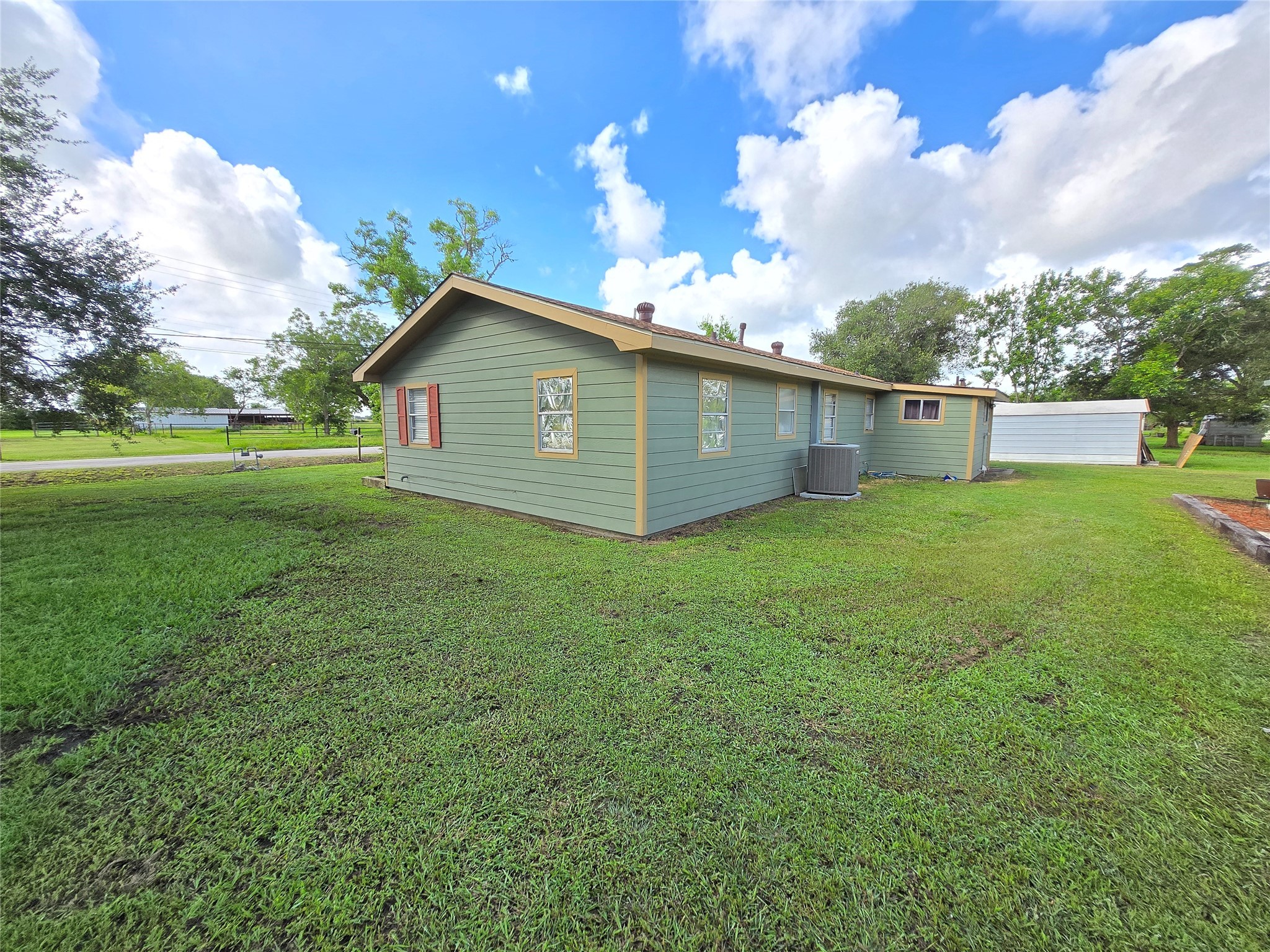 610 East Division Street Edna, TX 77957 - Photo 7 of 38 a view of a backyard with a garden