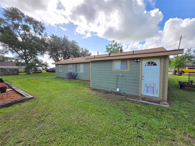 a backyard of a house with lots of green space