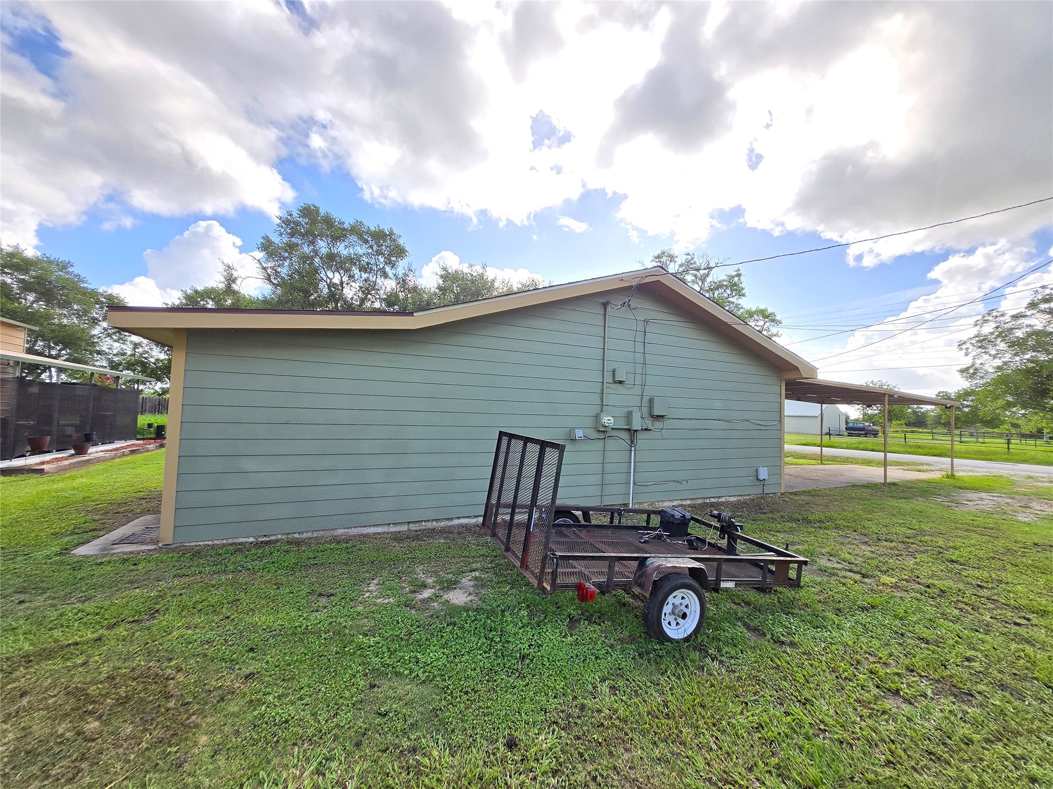 610 East Division Street Edna, TX 77957 - Photo 10 of 38 a view of a backyard with a garden