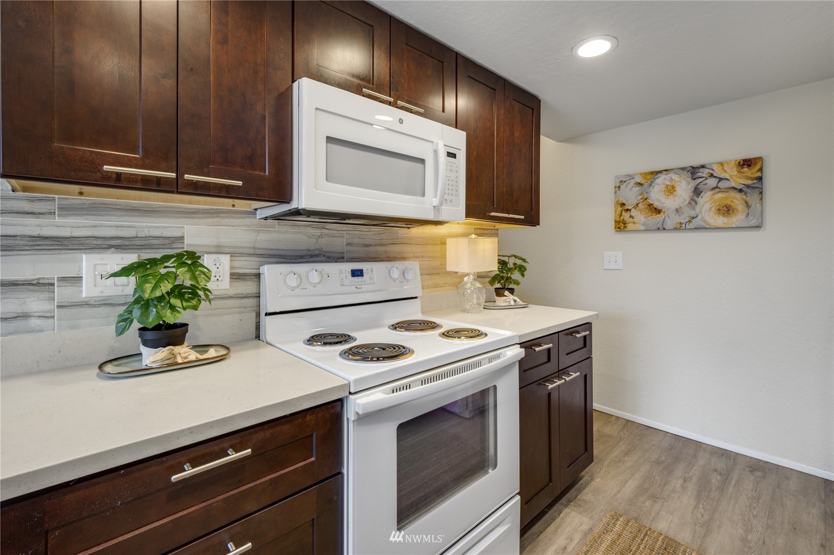 4100 Lake Washington Boulevard North, Unit D203 Renton, WA 98056 - Photo 16 of 30 a kitchen with a stove and cabinets