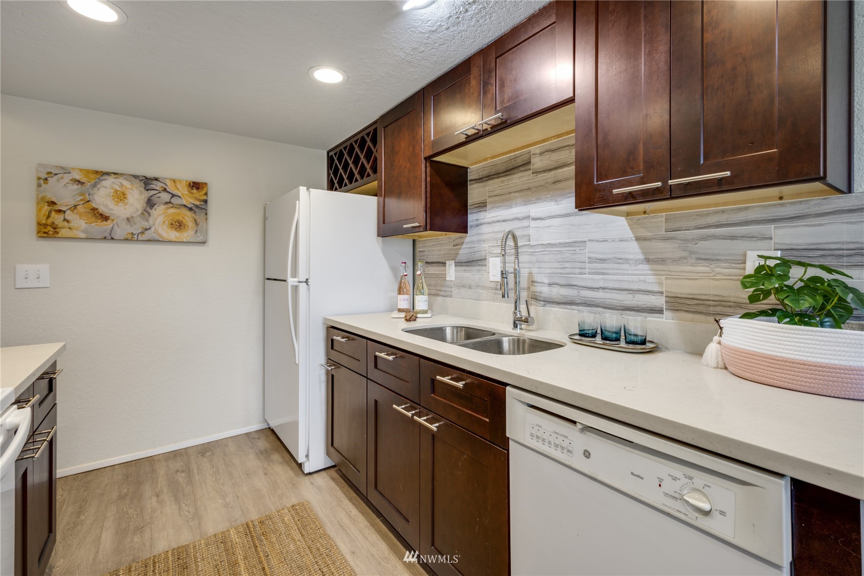 4100 Lake Washington Boulevard North, Unit D203 Renton, WA 98056 - Photo 17 of 30 a kitchen with a sink and a refrigerator