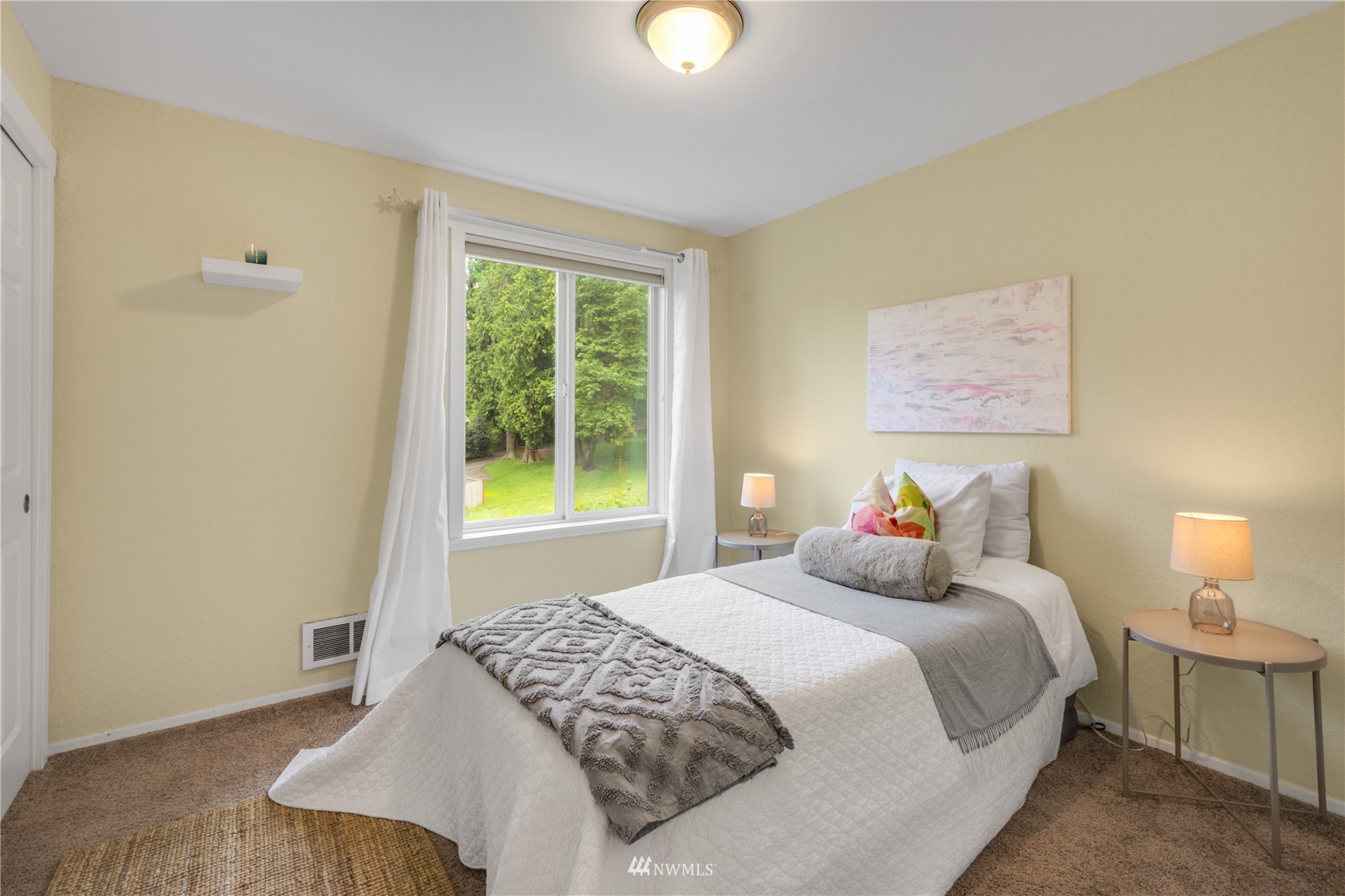 4100 Lake Washington Boulevard North, Unit D203 Renton, WA 98056 - Photo 22 of 30 a bedroom with a bed and a window