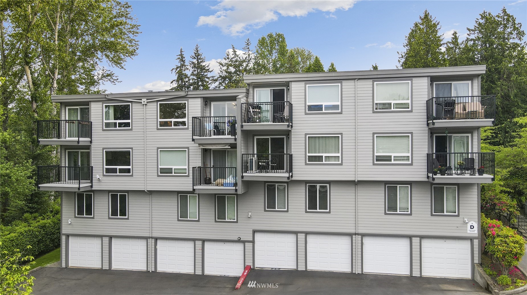 4100 Lake Washington Boulevard North, Unit D203 Renton, WA 98056 - Photo 27 of 30 a view of a building with a lot of windows