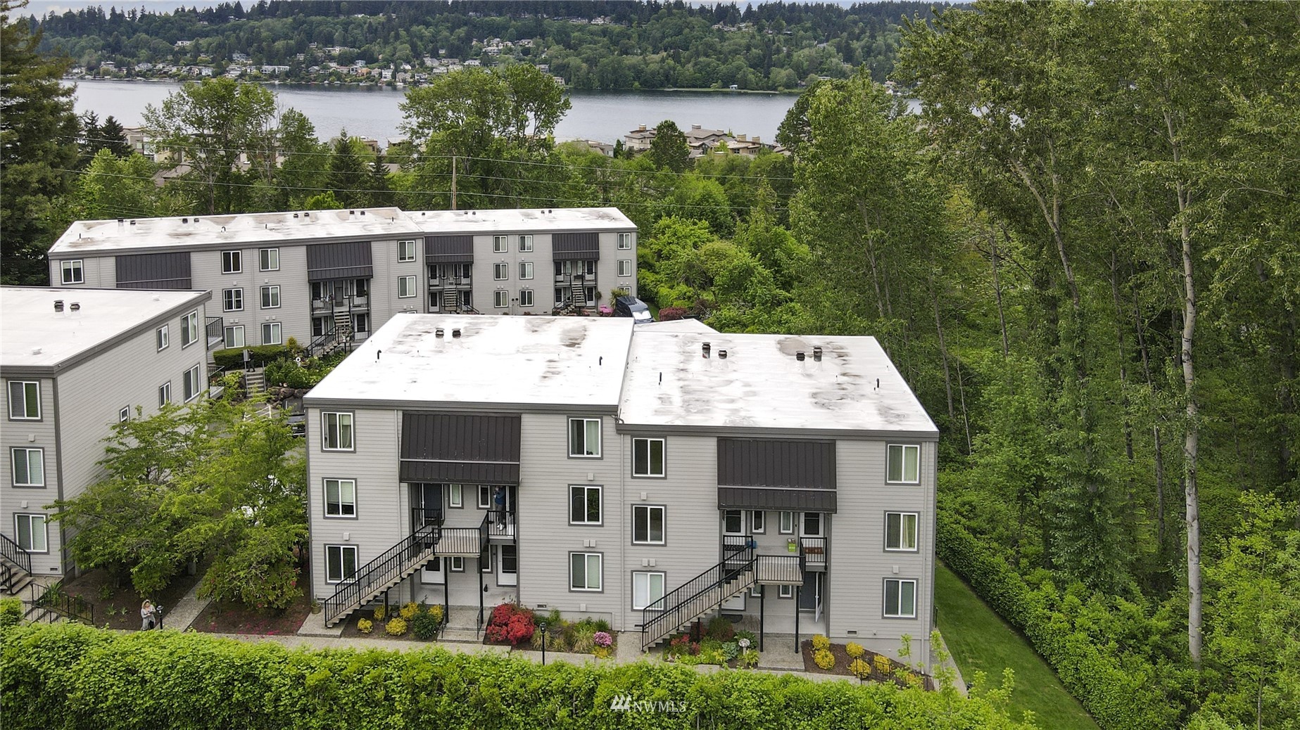 4100 Lake Washington Boulevard North, Unit D203 Renton, WA 98056 - Photo 29 of 30 front view of a house with a small yard