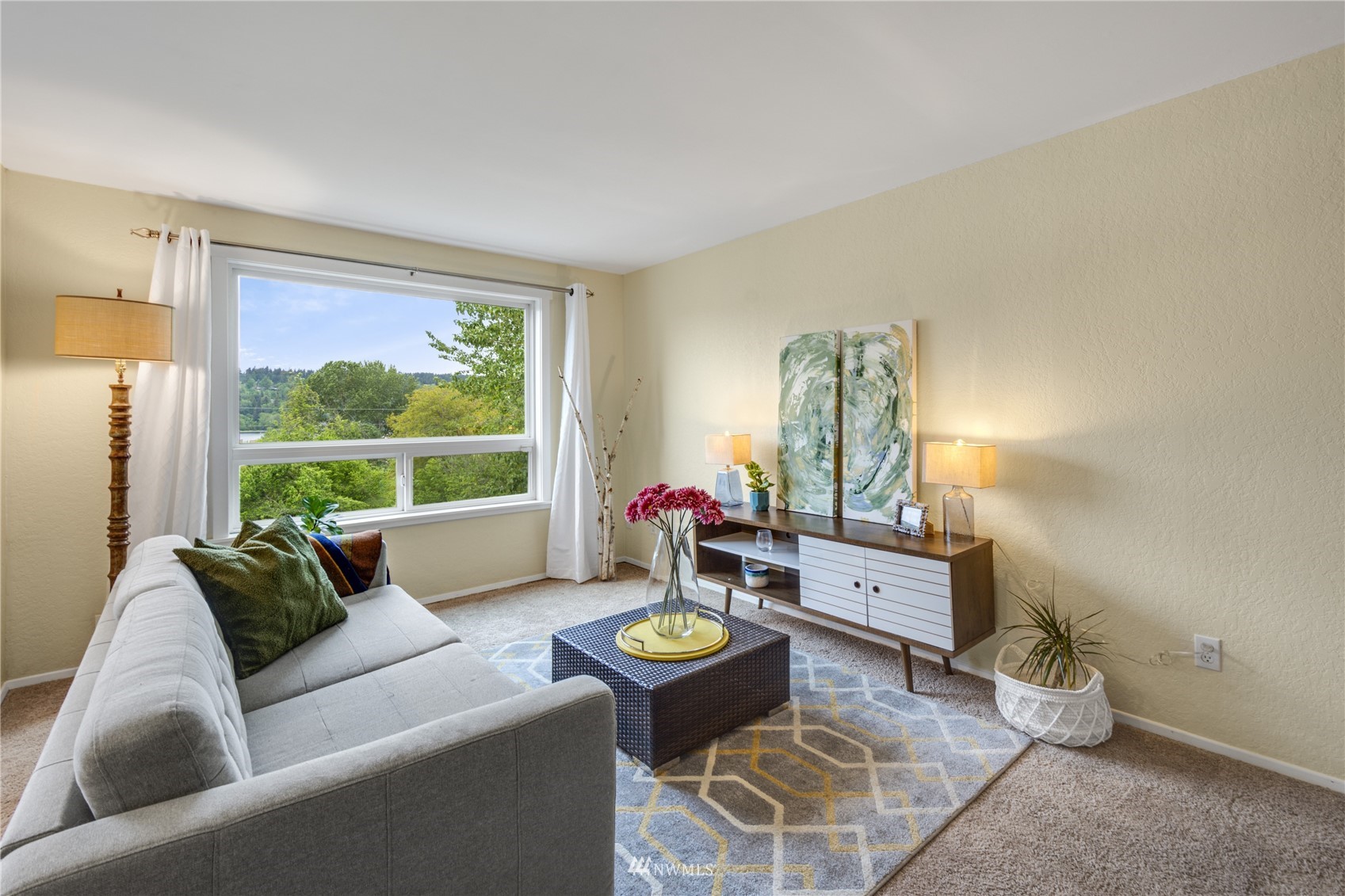 4100 Lake Washington Boulevard North, Unit D203 Renton, WA 98056 - Photo 7 of 30 a living room with furniture and a large window
