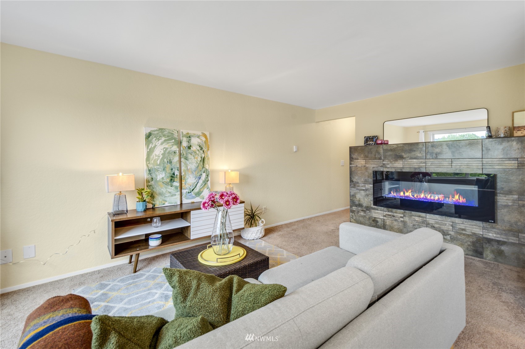 4100 Lake Washington Boulevard North, Unit D203 Renton, WA 98056 - Photo 8 of 30 a living room with furniture and a fireplace