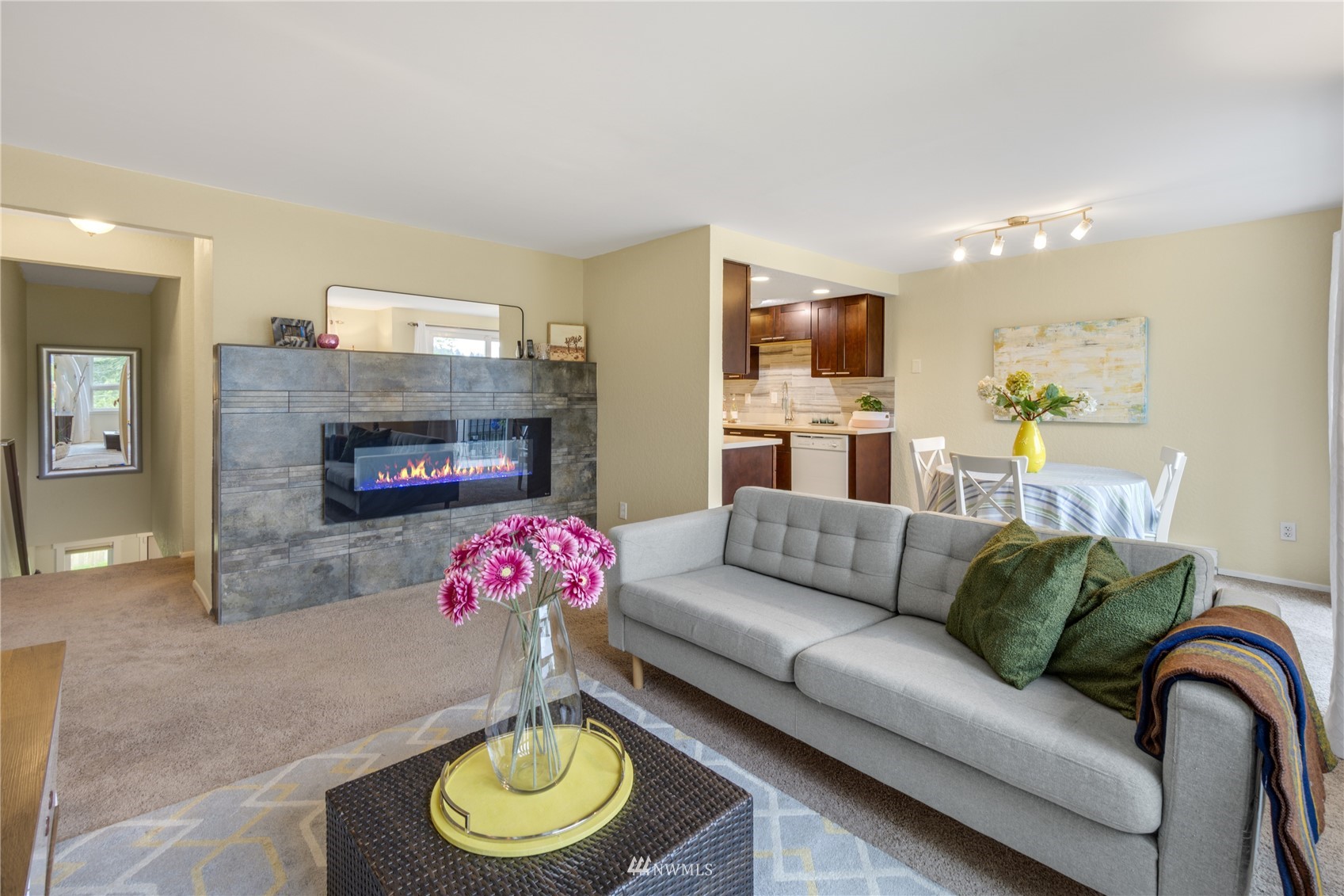 4100 Lake Washington Boulevard North, Unit D203 Renton, WA 98056 - Photo 10 of 30 a living room with furniture and a fireplace