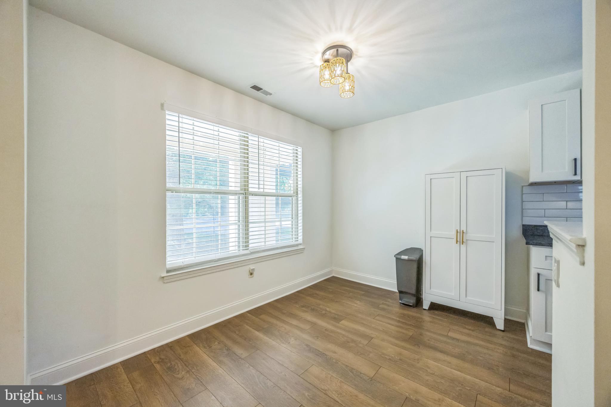 180 Tavistock Road Cherry Hill, NJ 08034 - Photo 6 of 15 an empty room with windows