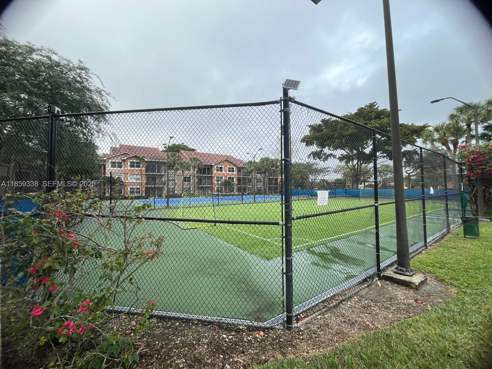 8821 Wiles Road, Unit 203 Coral Springs, FL 33067 - Photo 16 of 30 a view of a garden