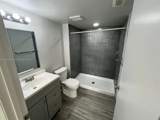 a bathroom with a sink and mirror