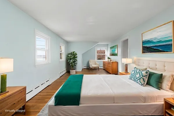 a bedroom with bed and window