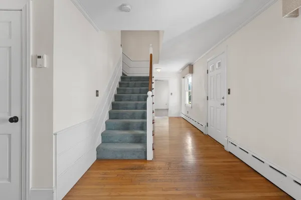 a bedroom with bed and window