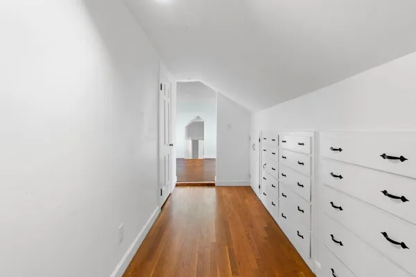 a spacious bedroom with a large bed and a flat screen tv