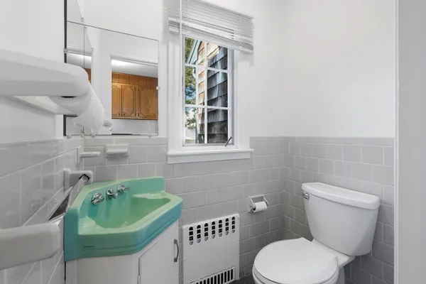 a view of a storage and utility room with washer and dryer