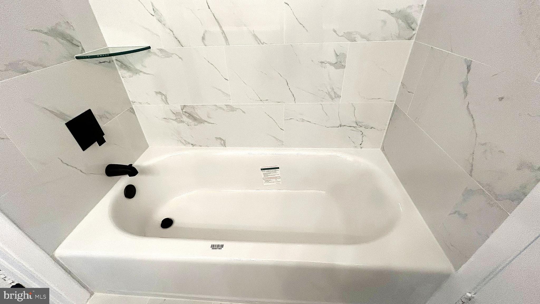 13 Consett Place, Unit 4H Frederick, MD 21703 - Photo 12 of 21 a bathroom with a tub