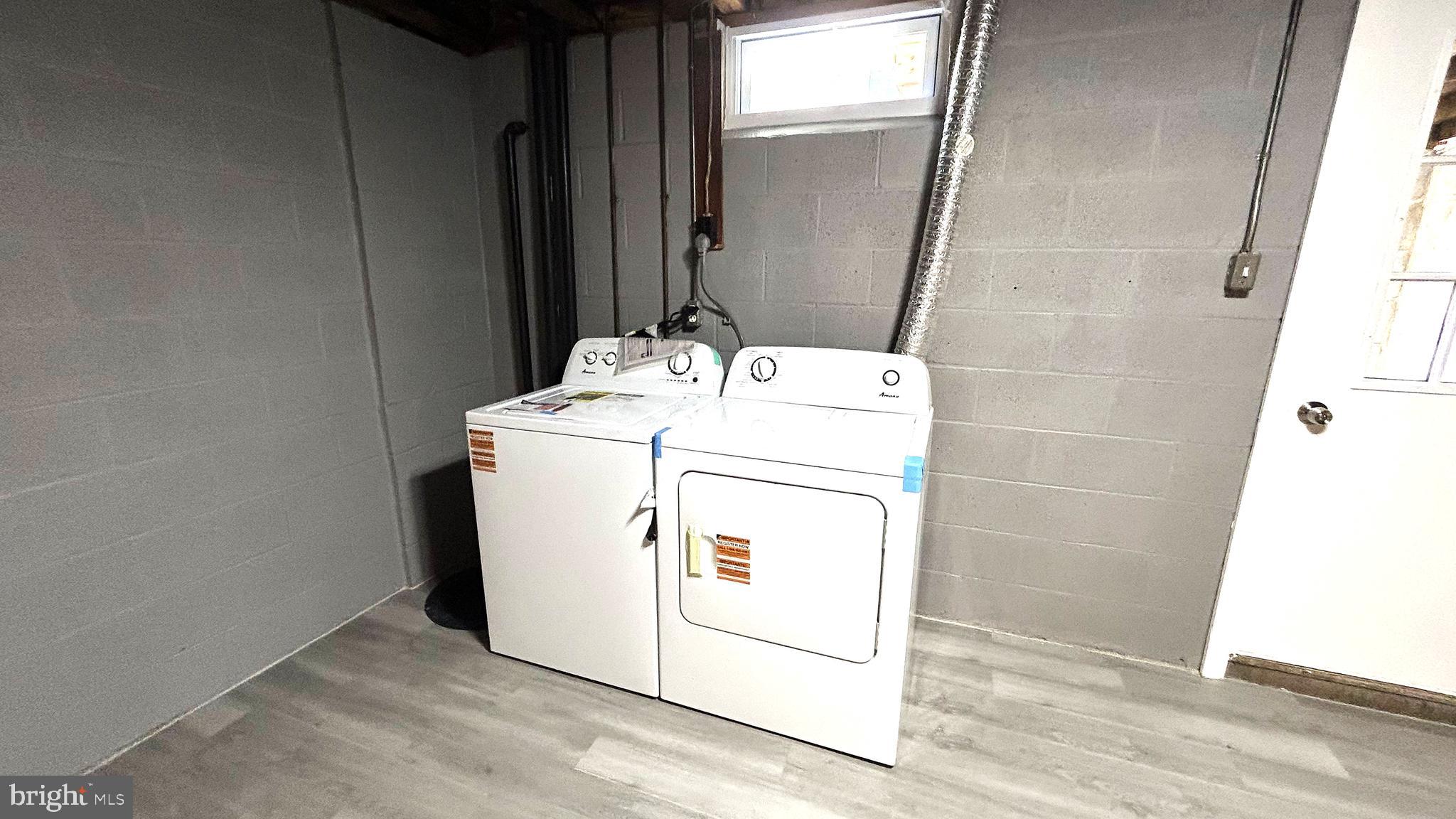 13 Consett Place, Unit 4H Frederick, MD 21703 - Photo 21 of 21 a utility room with dryer and washer