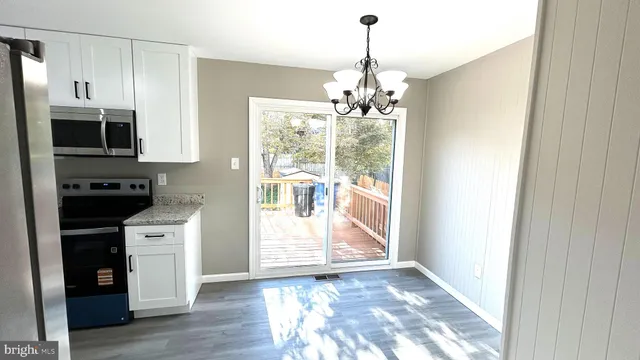 a view of a kitchen from the hallway