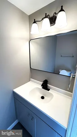 a bathroom with a sink and mirror