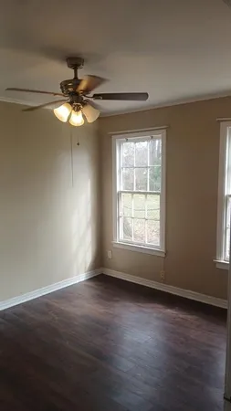a view of front door with wooden floor