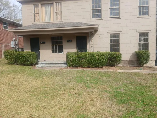 a front view of a house having yard