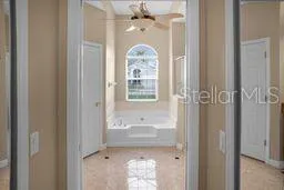 a bathroom with a mirror bathtub and a shower
