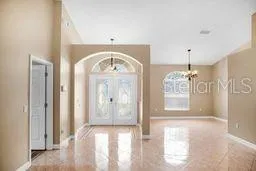 a view of hall way with furniture