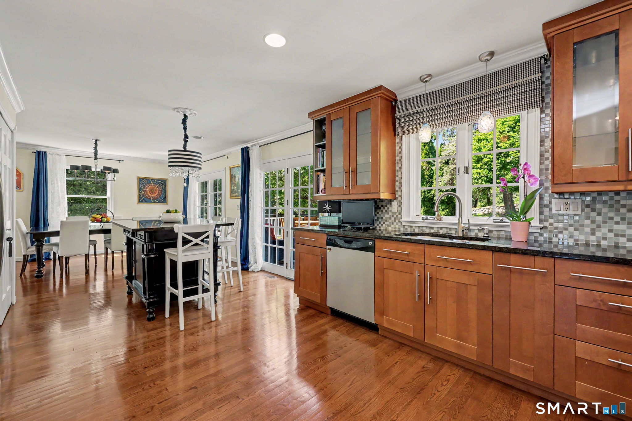 1100 Stillwater Road Stamford, CT 06902 - Photo 12 of 40 Open and Airy Eat-in Kitchen with French Door to Deck & Backyard