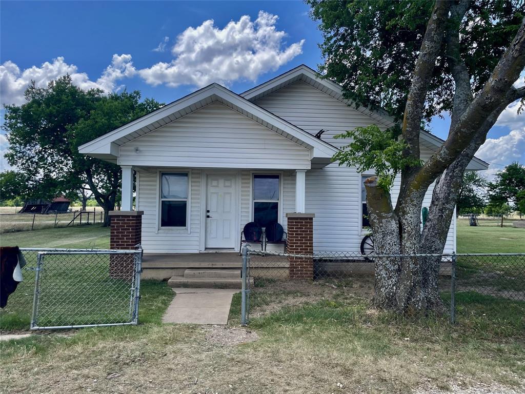 4969 Sam Bass Road Sanger, TX 76266 - Photo 2 of 5 Inviting front exterior with classic country appeal.