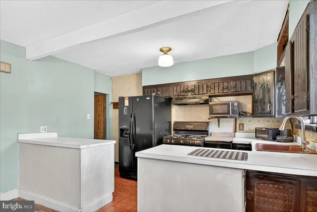 a kitchen with stainless steel appliances granite countertop a stove and a sink