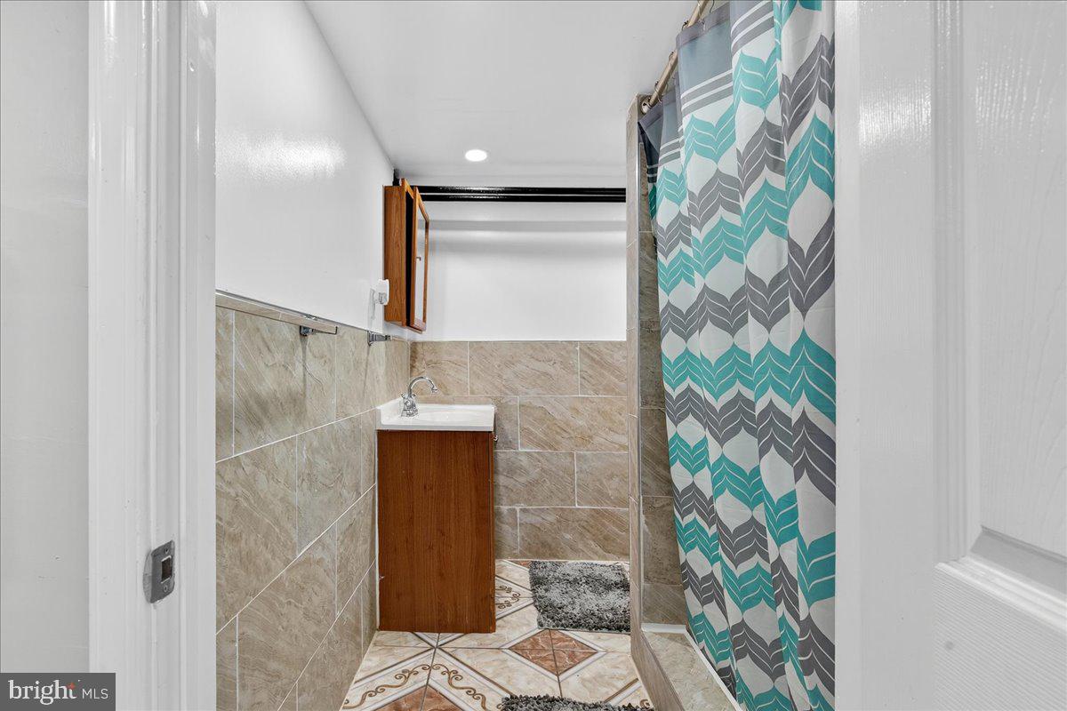 1440 Robbins Street Philadelphia, PA 19149 - Photo 29 of 31 a bathroom with a shower and a sink