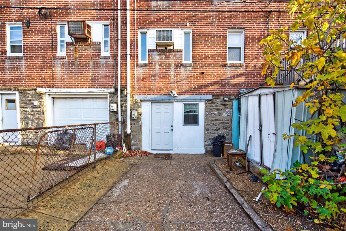 1440 Robbins Street Philadelphia, PA 19149 - Photo 31 of 31 a view of a house with a small yard and sitting area
