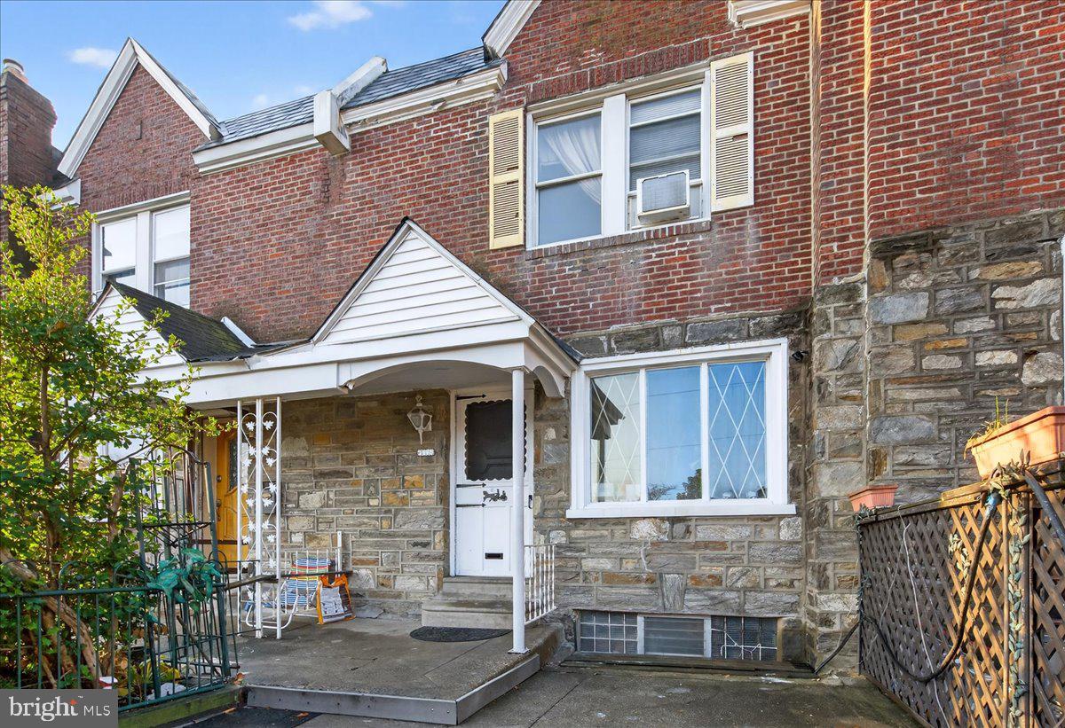 1440 Robbins Street Philadelphia, PA 19149 - Photo 4 of 31 a front view of a house with large windows