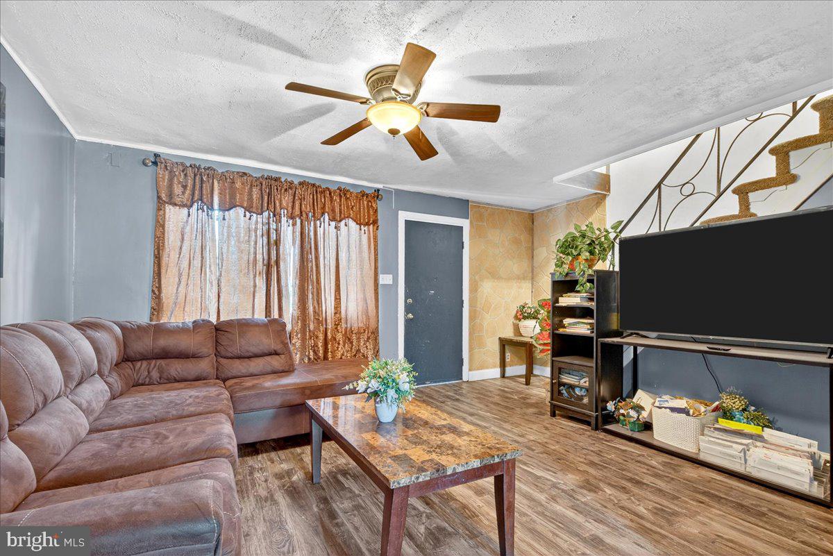 1440 Robbins Street Philadelphia, PA 19149 - Photo 8 of 31 a living room with furniture and a flat screen tv