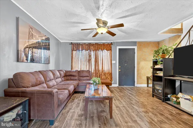 a kitchen with stainless steel appliances kitchen island granite countertop a sink and cabinets