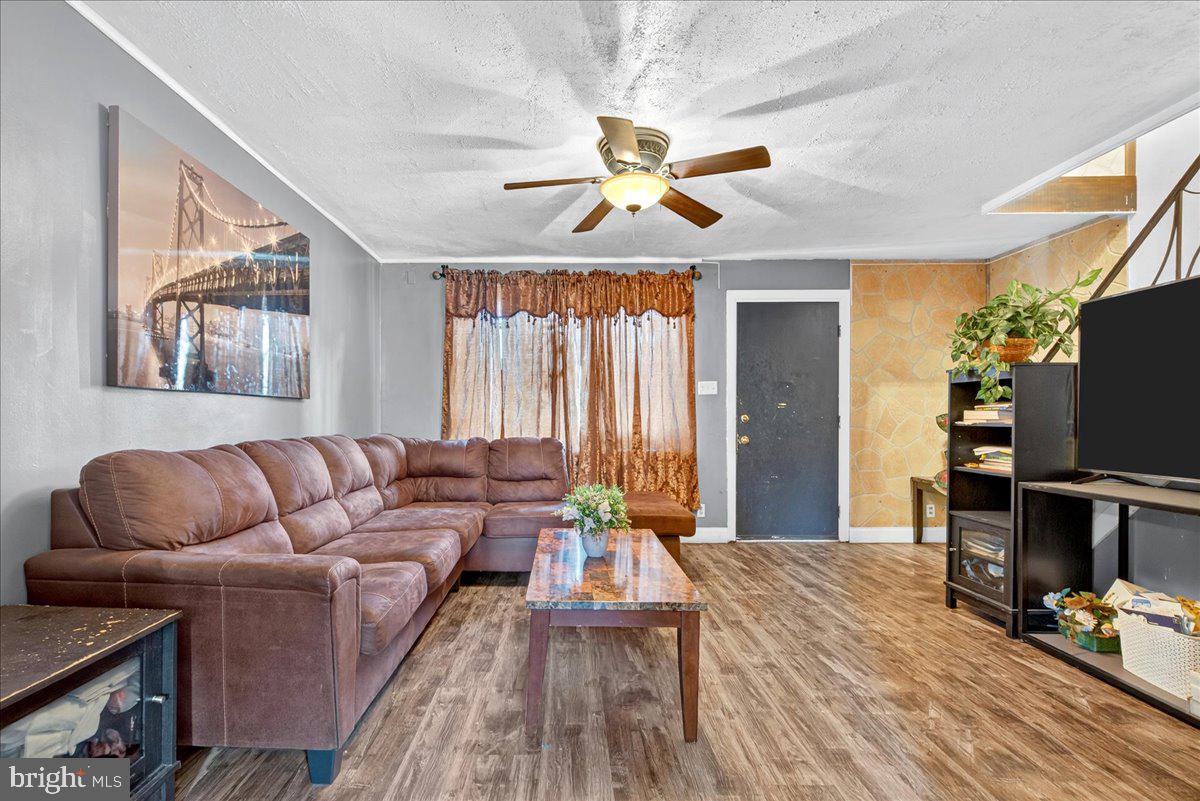 1440 Robbins Street Philadelphia, PA 19149 - Photo 9 of 31 a living room with furniture and a flat screen tv