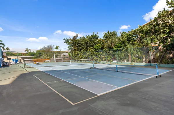 a view of a swimming pool with a lounge chair
