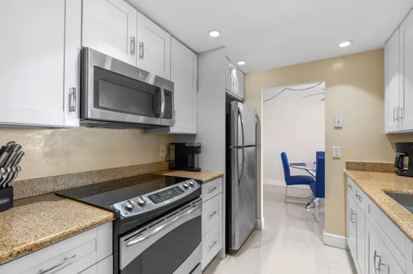 a kitchen with a stove and a microwave