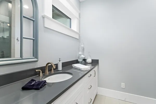 a bathroom with a sink and a mirror