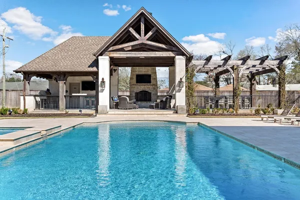 a view of a chairs and table in the balcony