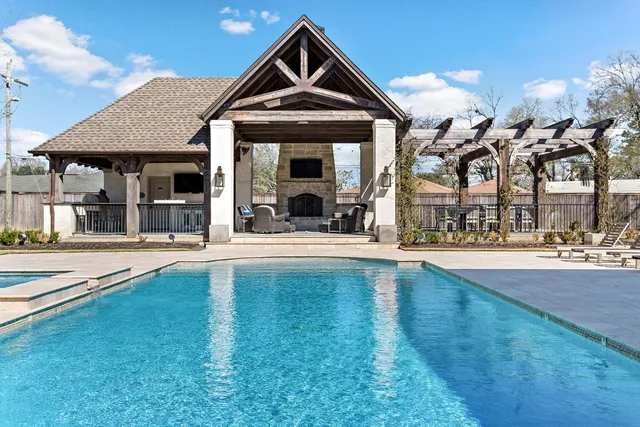 a view of a chairs and table in the balcony