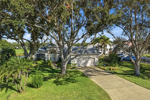 a view of yard with tree in the background