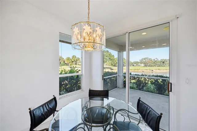 a kitchen with granite countertop a refrigerator and a sink