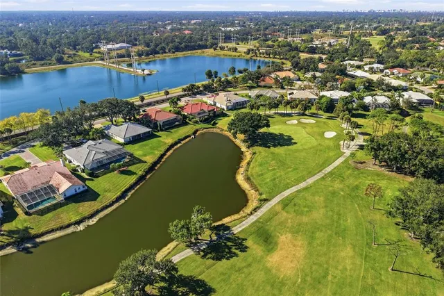 a view of a patio with table and chairs under an umbrella