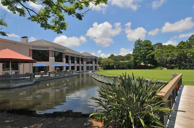 an aerial view of residential house with outdoor space and swimming pool