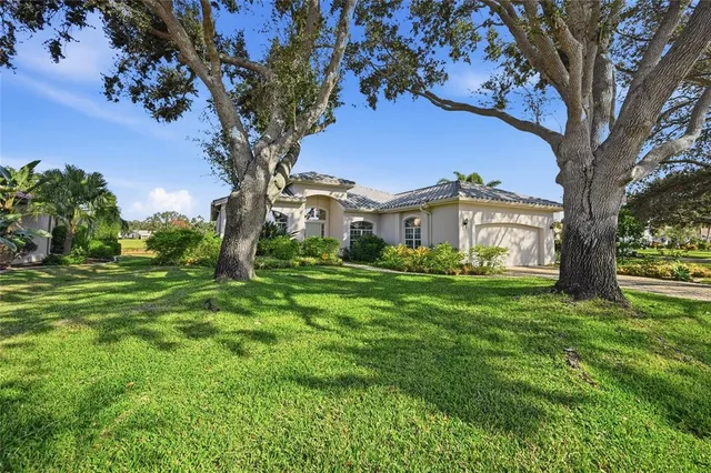 a backyard of a house with lots of green space