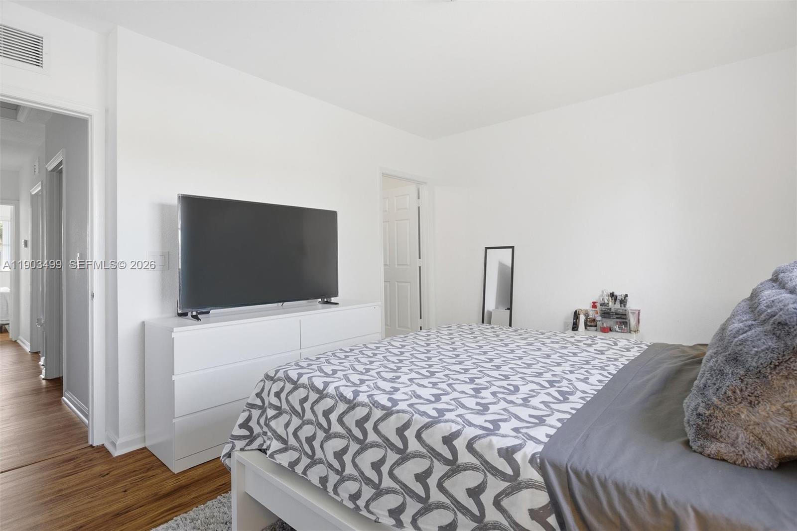 8231 Southwest 29th Street Miramar, FL 33025 - Photo 33 of 53 a bedroom with a bed and a flat screen tv